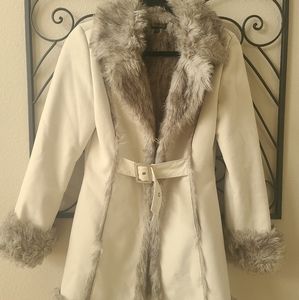 White jacket with fur lining.